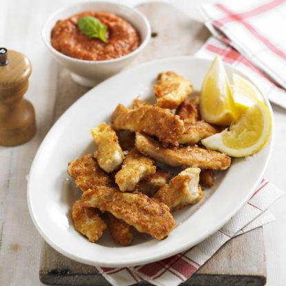 Parmesan chicken goujons with roasted tomato and garlic dipping sauce recipe-woman and home