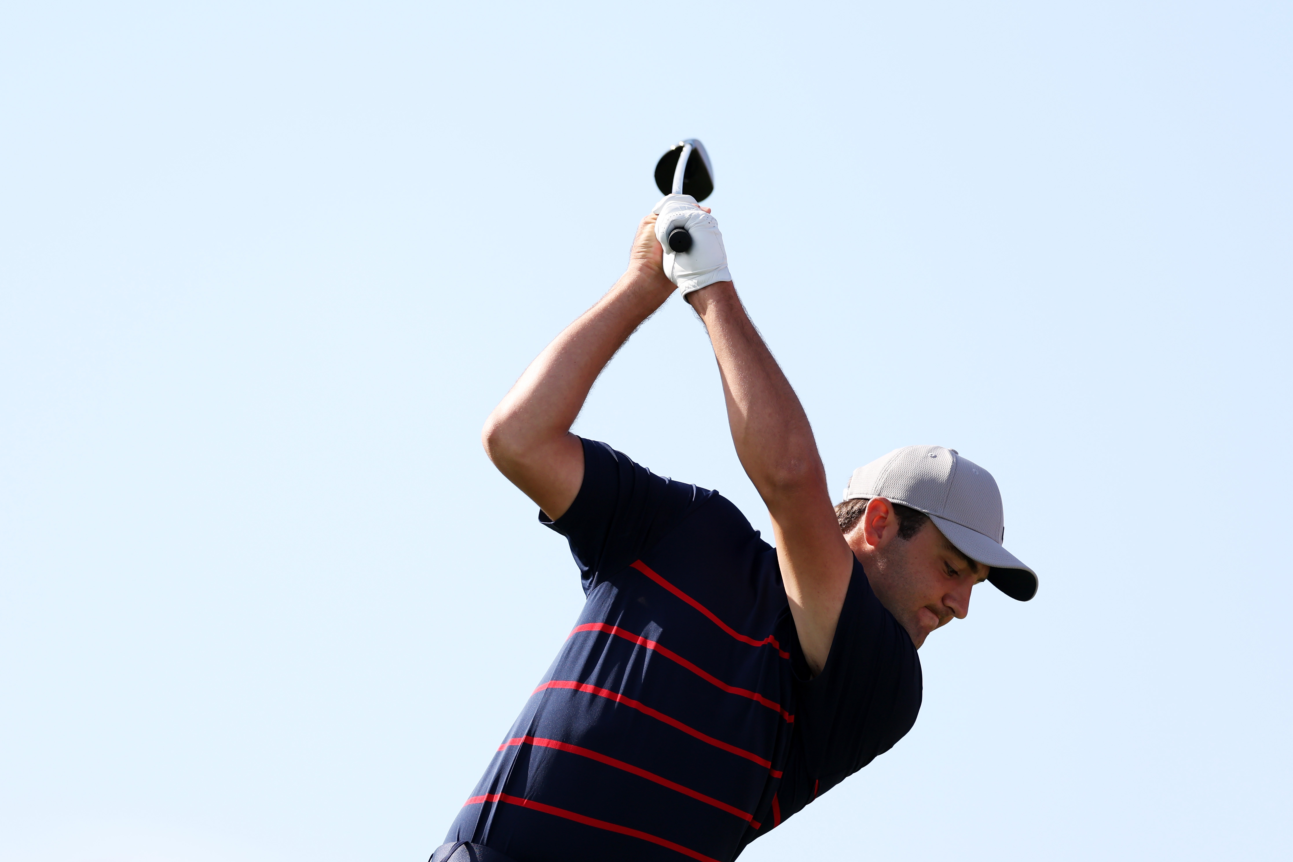 Scottie Scheffler at the top of his backswing
