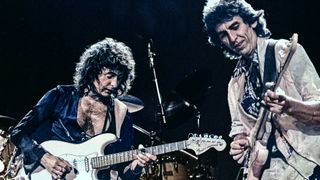 Ritchie Blackmore performs onstage with George Harrison on Deep Purple's Perfect Strangers World Tour at the Entertainment Centre, Sydney, Australia, December 12, 1984. 