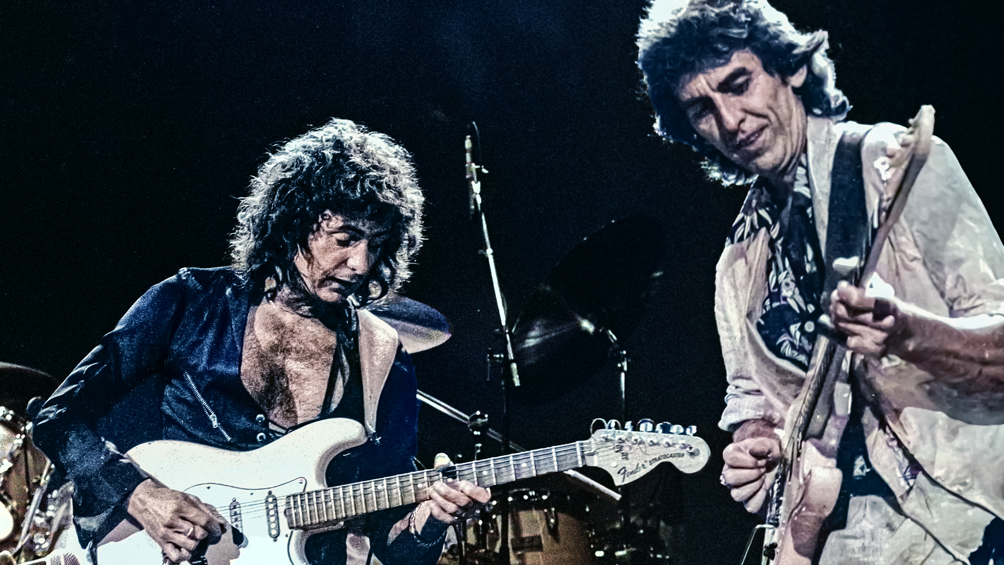 Ritchie Blackmore performs onstage with George Harrison on Deep Purple's Perfect Strangers World Tour at the Entertainment Centre, Sydney, Australia, December 12, 1984. 