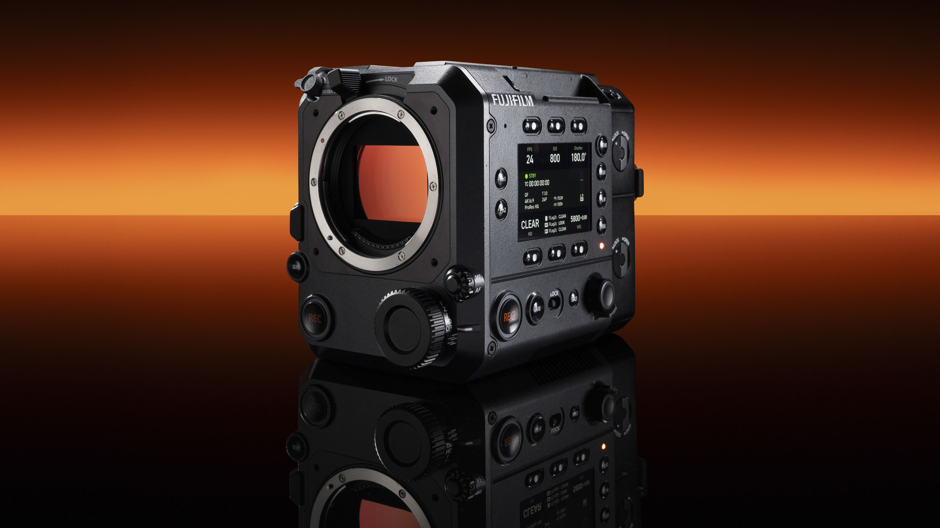 Fujifilm GFX Eterna 55 cinema camera without lens, punchy orange strip light in the background