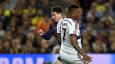 Lionel Messi speeds past Jerome Boateng