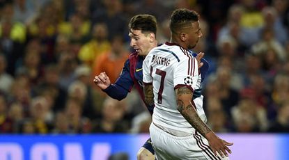 Lionel Messi speeds past Jerome Boateng
