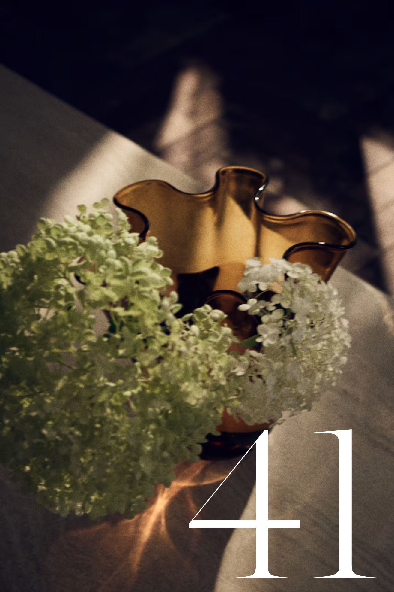amber rippled vase with hydrandeas