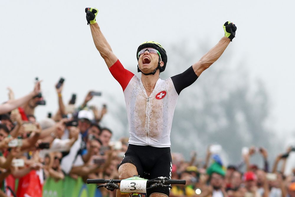 Nino Schurter celebrates his Olympic gold medal