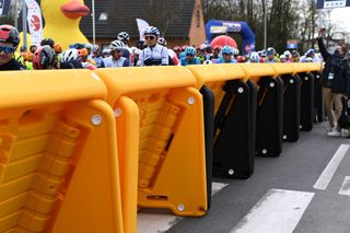 HARELBEKE BELGIUM MARCH 26 Start The Peloton during the 64th E3 Saxo Bank Classic 2021 a 2039km race from Harelbeke to Harelbeke Safety Barriers Detail view E3SaxobankClassic on March 26 2021 in Harelbeke Belgium Photo by Tim de WaeleGetty Images