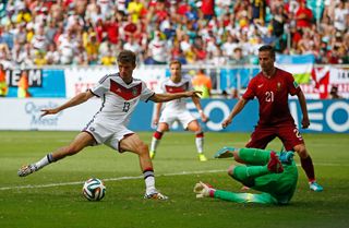 Thomas Müller scores his third goal and Germany's fourth against Portugal at the 2014 World Cup in Brazil.