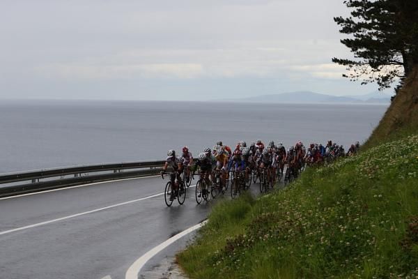 High above sea level where the race began, the bunch climbs on the coast road.