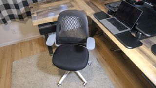 The Haworth Breck office chair in front of an L-shaped desk