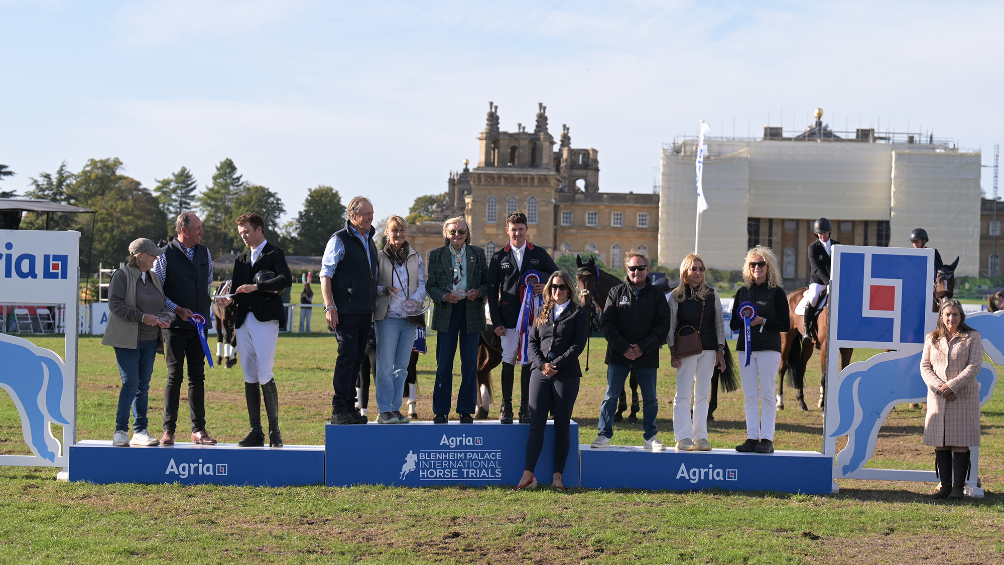 The top three riders and the owners of their horses on the podium at Blenheim Horse Trials 2026