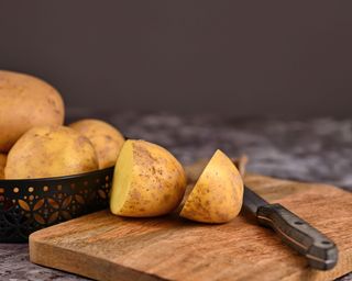 sliced potato on a chopping board
