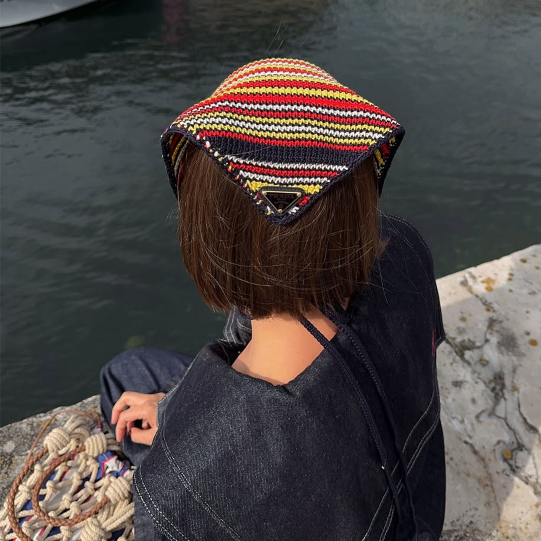 Mary L. Jean wears a knitted bandana by Prada in Copenhagen, Denmark