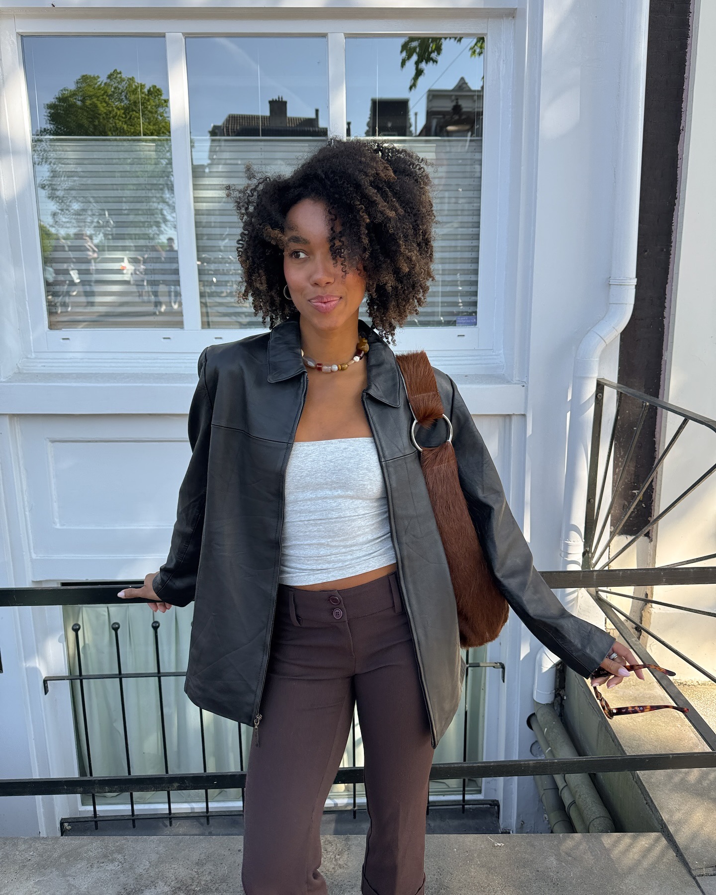 Influencer wearing brown slim pants