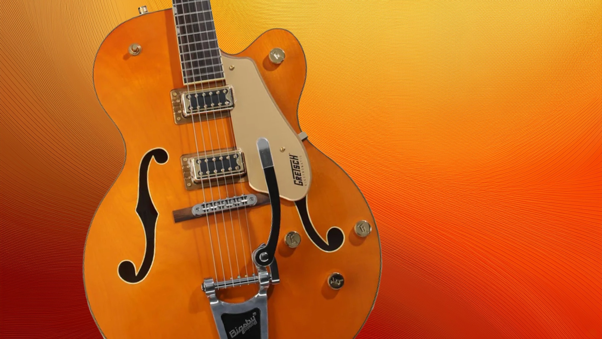 A Gretsch G5420TG-59 Electromatic Hollowbody guitar against an orange and white background