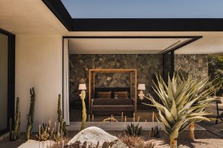 rancho mirage house showcasing low lying, modernist architecture with lots of desert planting and outdoor areas