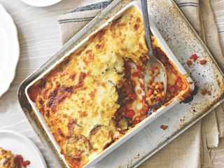 A Moussaka with a spoonful served from it