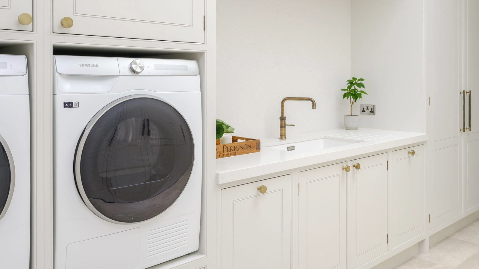 Tumble dryer in a cream fitted utility room