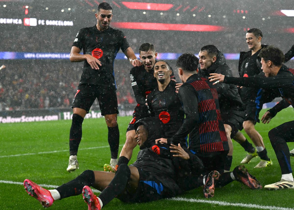 Raphinha celebrates with his team-mates after scoring a late winner for Barcelona against Benfica in the Champions League in January 2025.