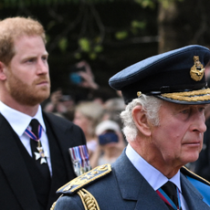  Britain's King Charles III and Britain's Prince Harry, Duke of Sussex walk behind the coffin of Queen Elizabeth II, adorned with a Royal Standard and the Imperial State Crown and pulled by a Gun Carriage of The King's Troop Royal Horse Artillery, during a procession from Buckingham Palace to the Palace of Westminster, in London on September 14, 2022.