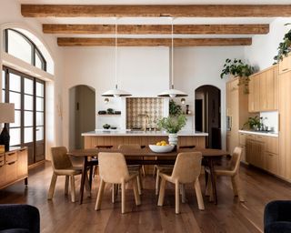 Furniture trends, rustic kitchen-diner with central wooden dining table and chairs