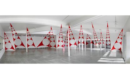 Felice Varini's latest solo exhibition at Paris' Parc de la Villette is a triumph of optical illusion. Pictured here is 'Quatorze triangles percés/penchés', 2015
