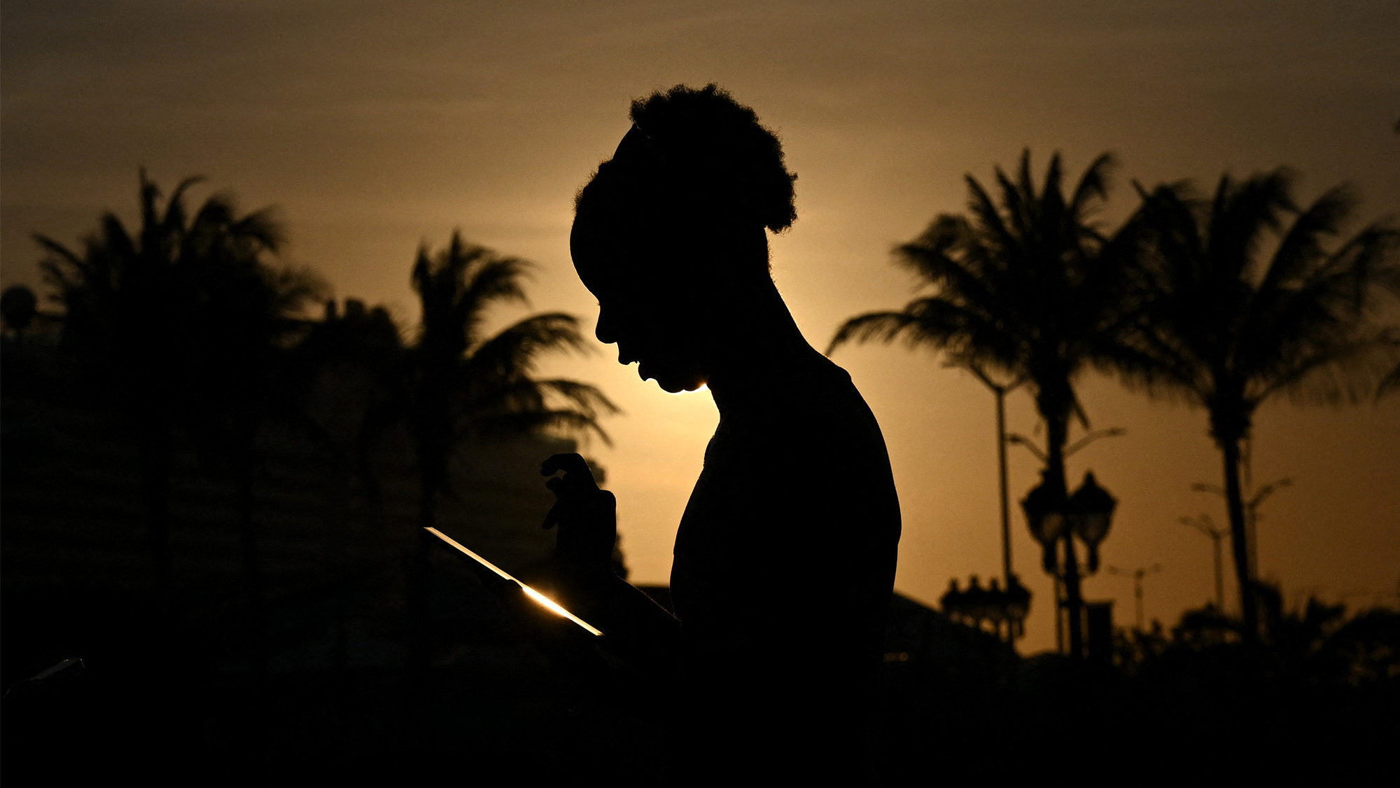 A silhouette of a woman is seen in the old town of Willemstad, Curacao, in the Dutch Caribbean