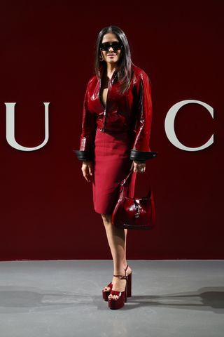 Salma Hayek Gucci show red jacket skirt platform sandals high heels Milan Fashion Week