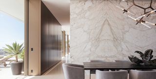 marble walled dining room in contemporary house in Bel Air
