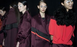 5 female models backstage wearing outfits from the Kenzo A/W 2015 collection