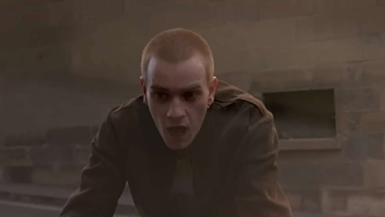 Ewan McGregor looking stunned and almost being hit by a car in Trainspotting