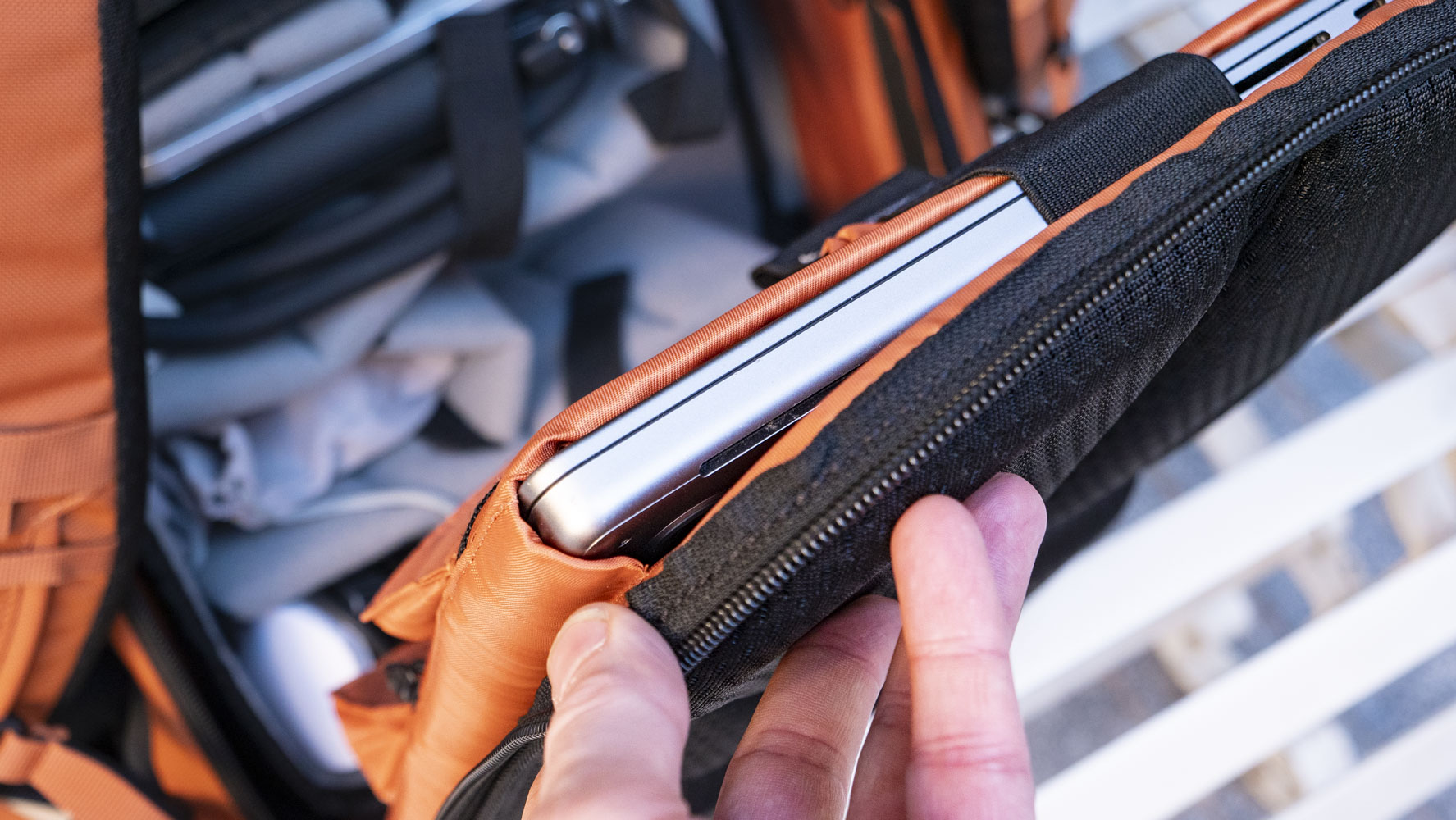 Wandrd PRVKE V4 bag on a white metal bench 