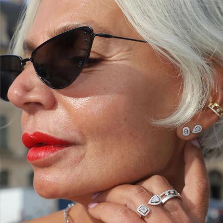 Woman wears diamond earrings