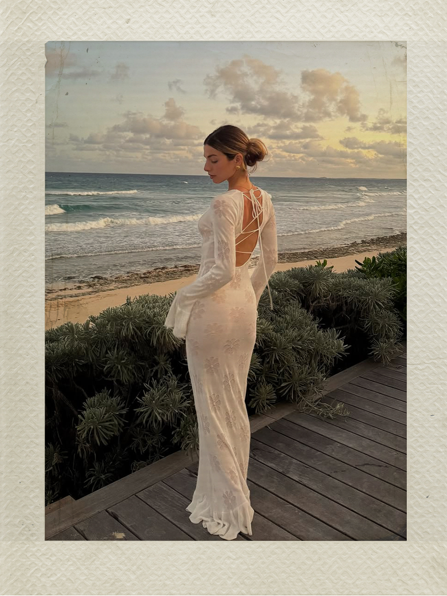Kit Keenan wears a white knitted dress while vacationing in Elbow Cay, Bahamas