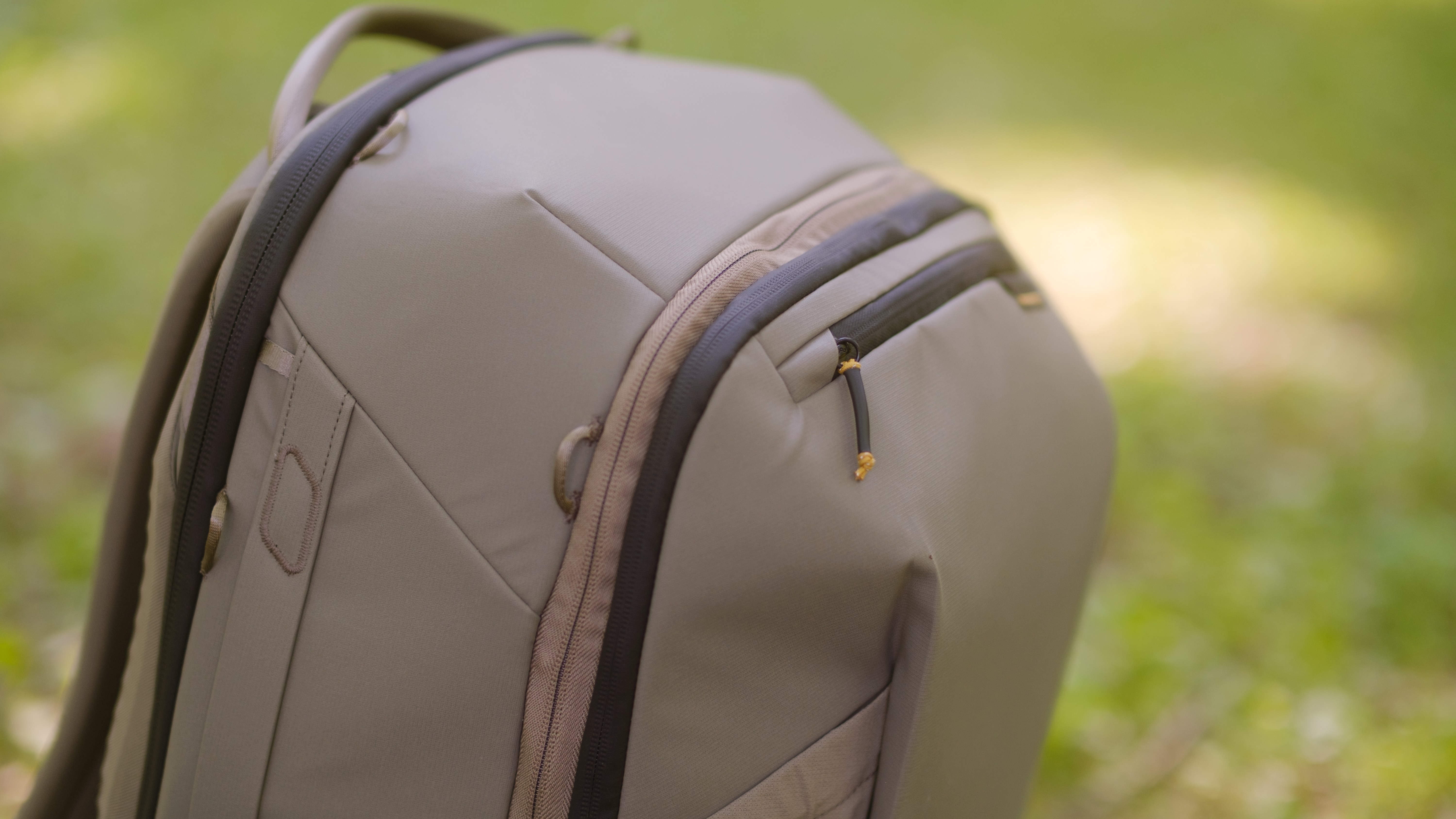 The Peak Design Travel 2-in-1 Backpack outdoors used by a photographer