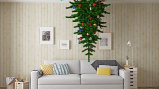 upside down christmas tree suspended from a ceiling