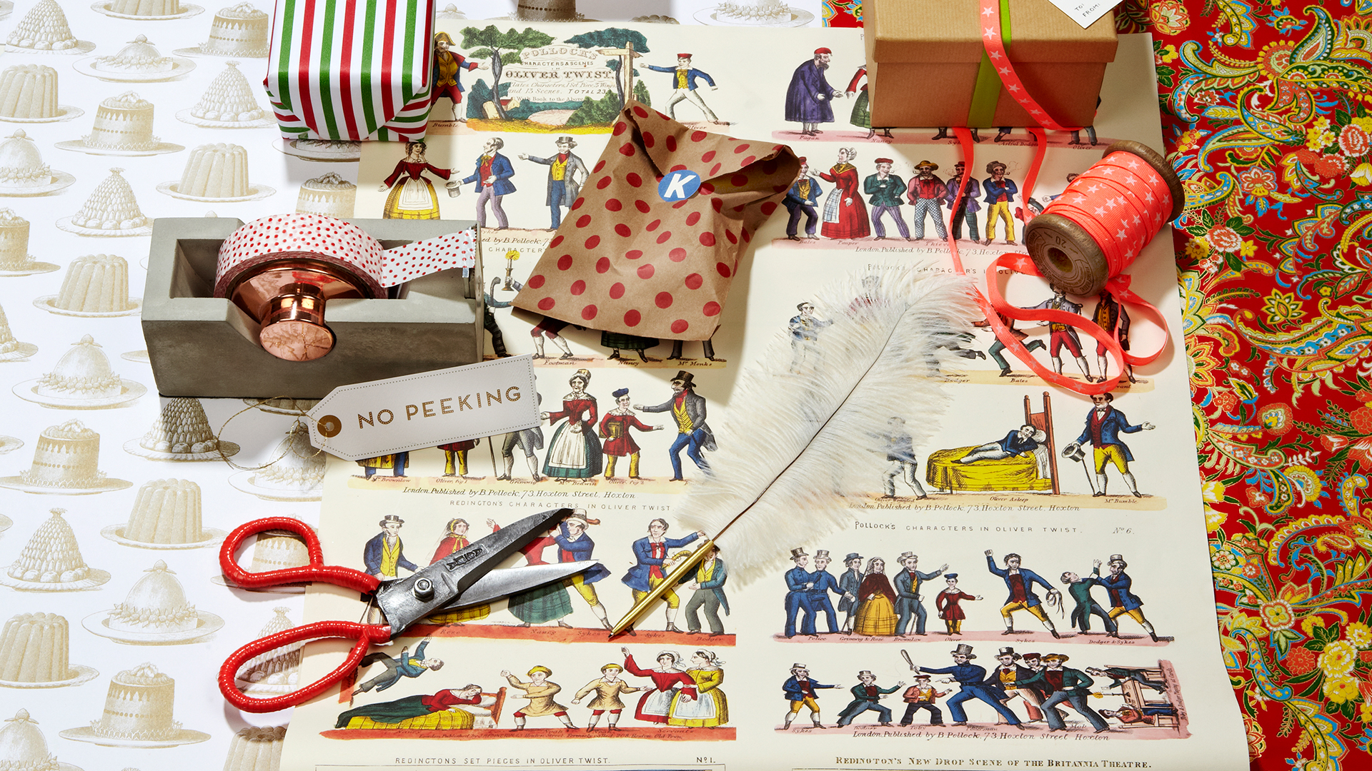 Christmas wrapping paper, scissors and cellotape on a roll