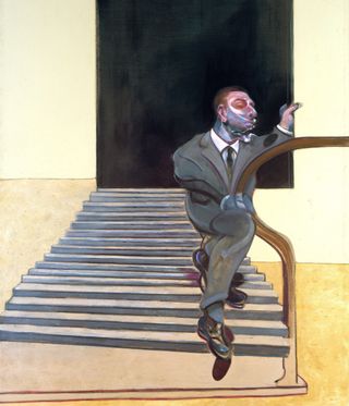 Man in gray suit on the stairs