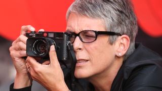 7th July, 2007: Jamie Lee Curtis photographing the Live Earth concert at Wembley, London. Former U.S. Vice President Al Gore and his global partners are staging the Live Earth concerts, held on seven continents simultaneously, with some of the biggest names in music playing for 24 hours across the globe to raise awareness of global warming. (Photo by Justin Goff Photos/Getty Images)
