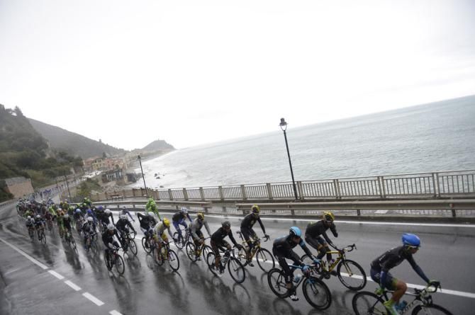 The peloton race along the coastline in Milan-San Remo