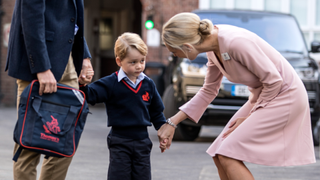 Prince George of Cambridge arrives for his first day of school with his father Prince William, Duke of Cambridge as they are met Head of the lower school Helen Haslem at Thomas's Battersea on September 7, 2017 in London, England