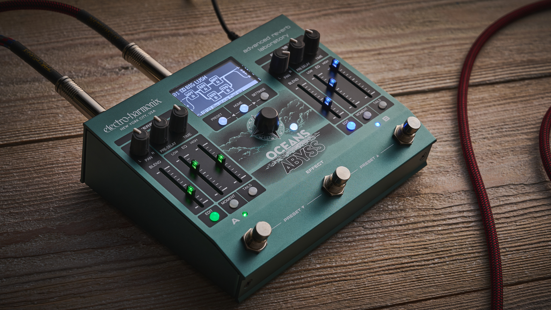 An Electro-Harmonix Oceans Abyss reverb pedal on a wooden floor
