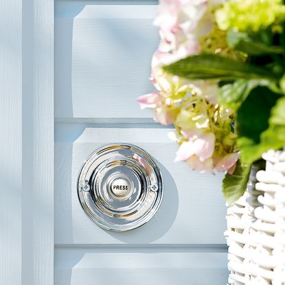 shiny silver coloured doorbell