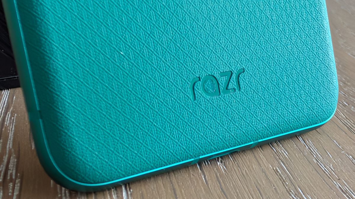 Motorola Razr 2026 in blue, being held in the hand