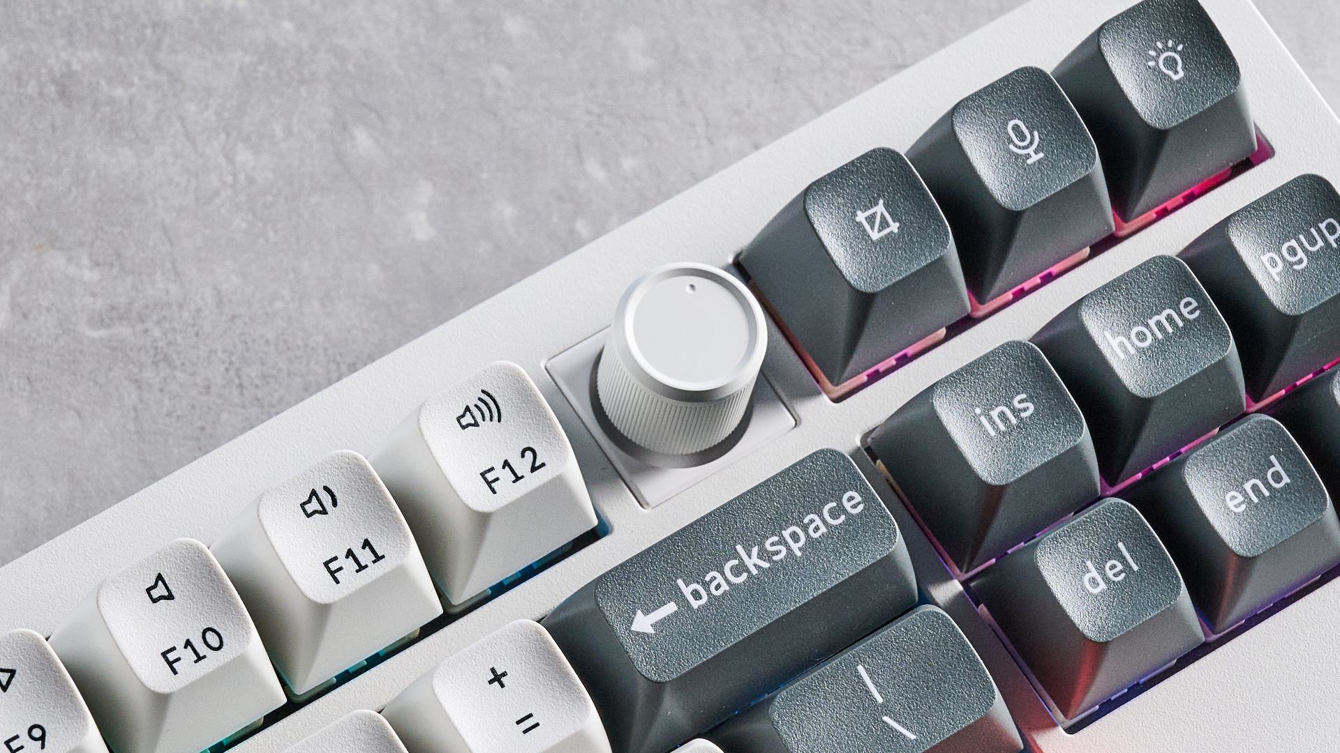 Keychron Q3 Ultra 8K photographed on a grey table in front of a blue background