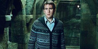 Matthew Lewis standing in a hallway in Harry Potter and the Deathly Hallows: Part 2.