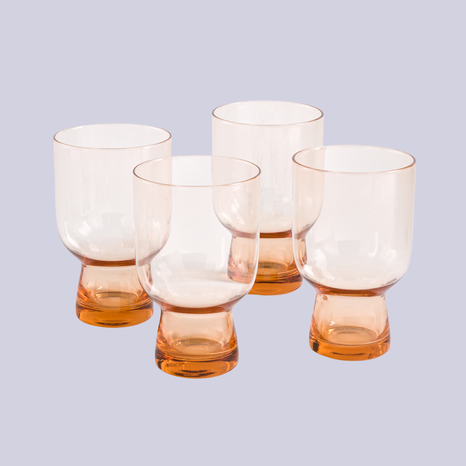 A set of apricot-colored footed glassware