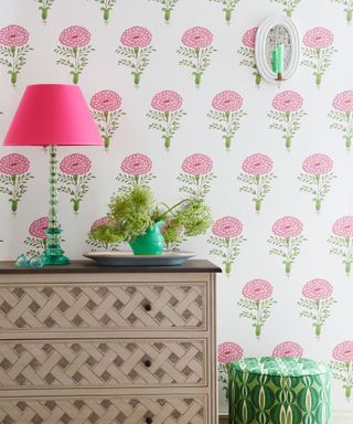Country decorating ideas - block print floral wallpaper with trellis chest of drawers and green and pink table lamp