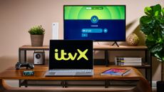ITVX logo on a laptop in a living room scene