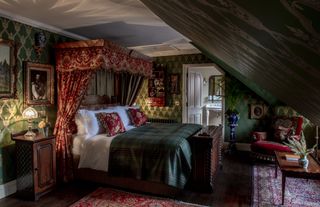 A bed in the Victoriana Suite at the Fife Arms Hotel in Braemar, Scotland