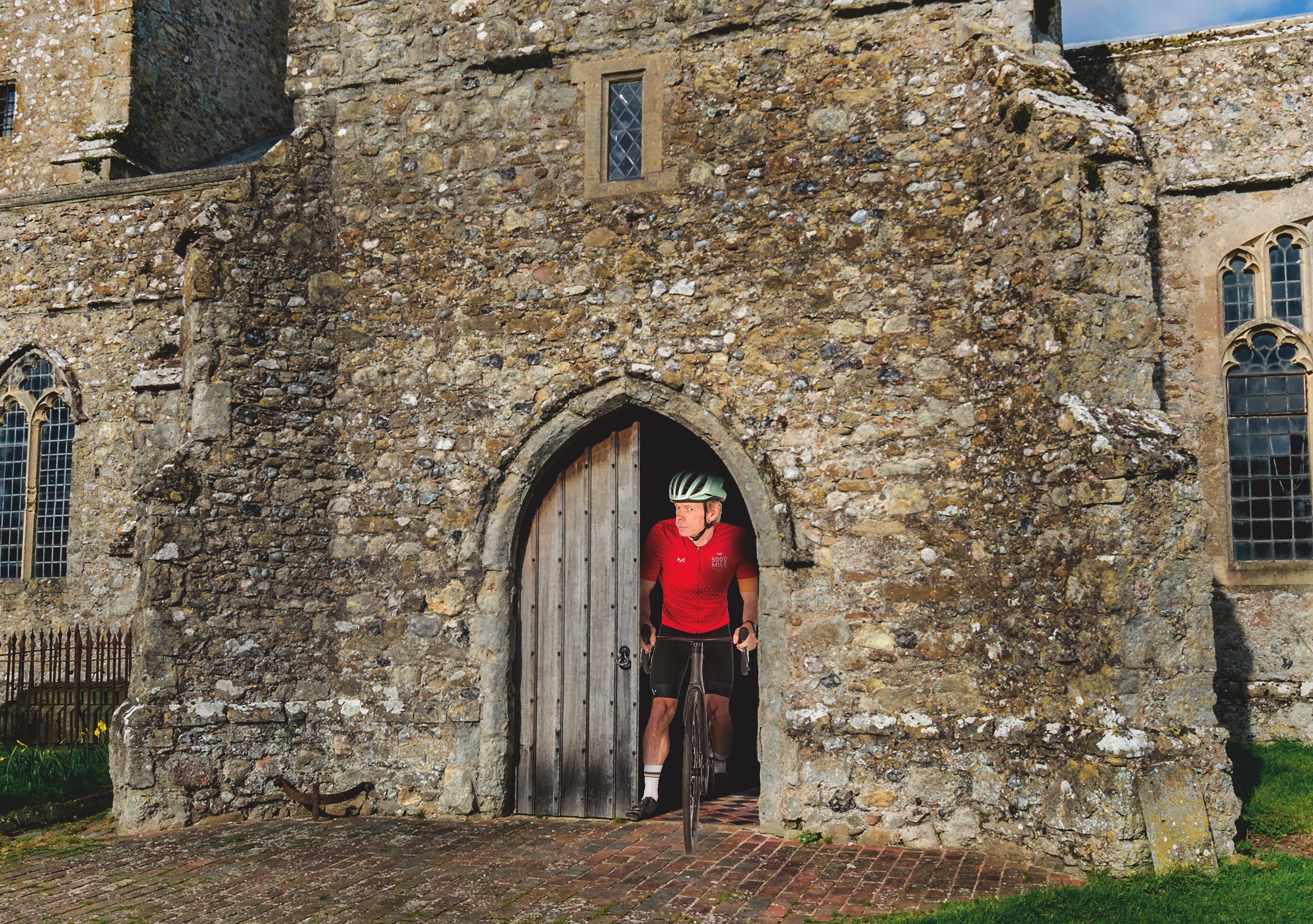 Dr Hutch cycles out of a church